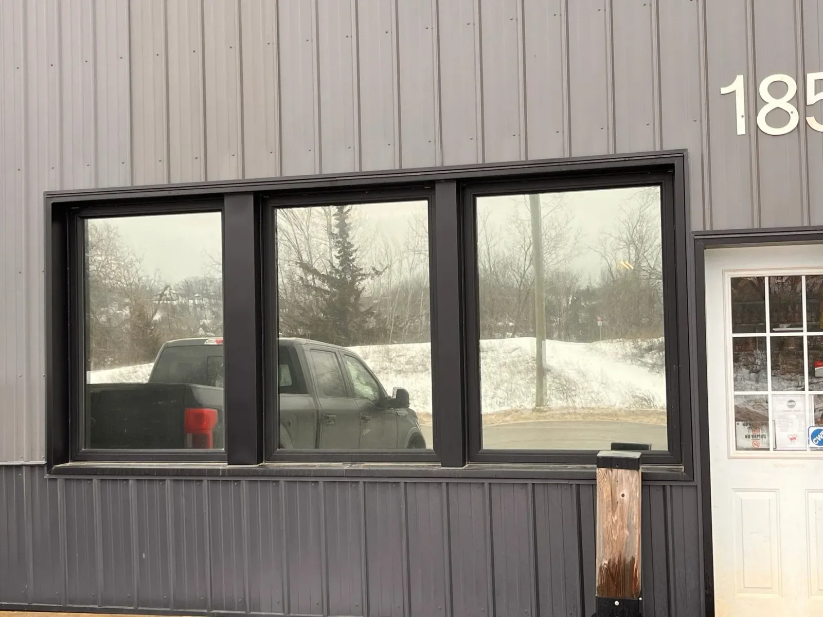 Close-up of dark reflective film on commercial windows